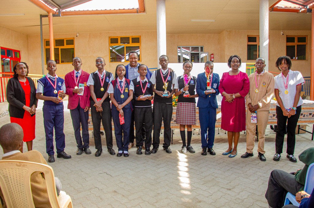 Award-winning students with medals and trophies at the Acacia Crest maths contest